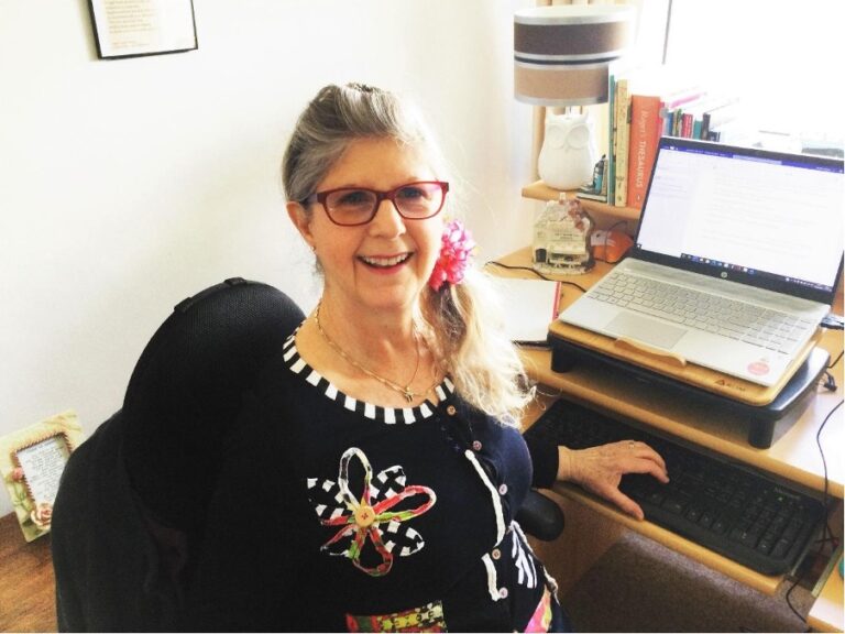 Lois Davis at her desk